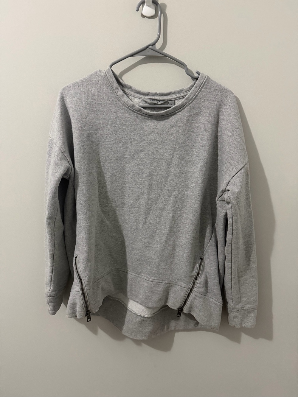 Athleta gray crewneck sweatshirt with zipper detail.